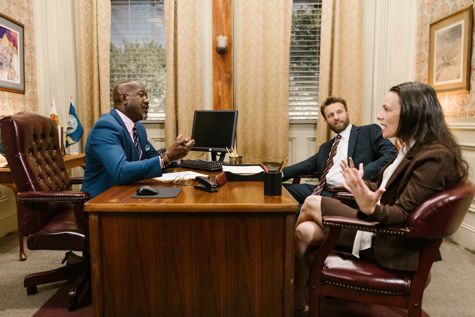 Attorneys meeting with a client at a personal injury law firm